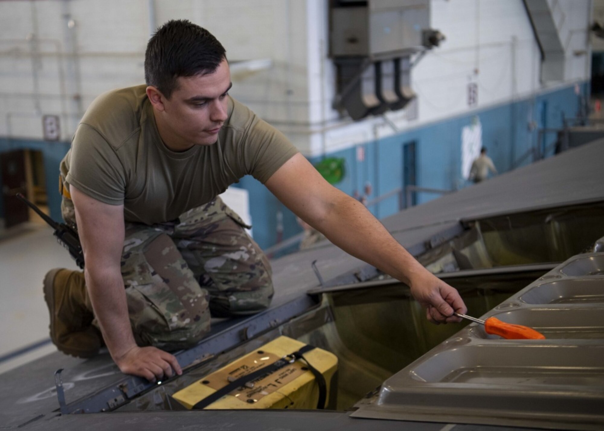 Airmen work on aircraft