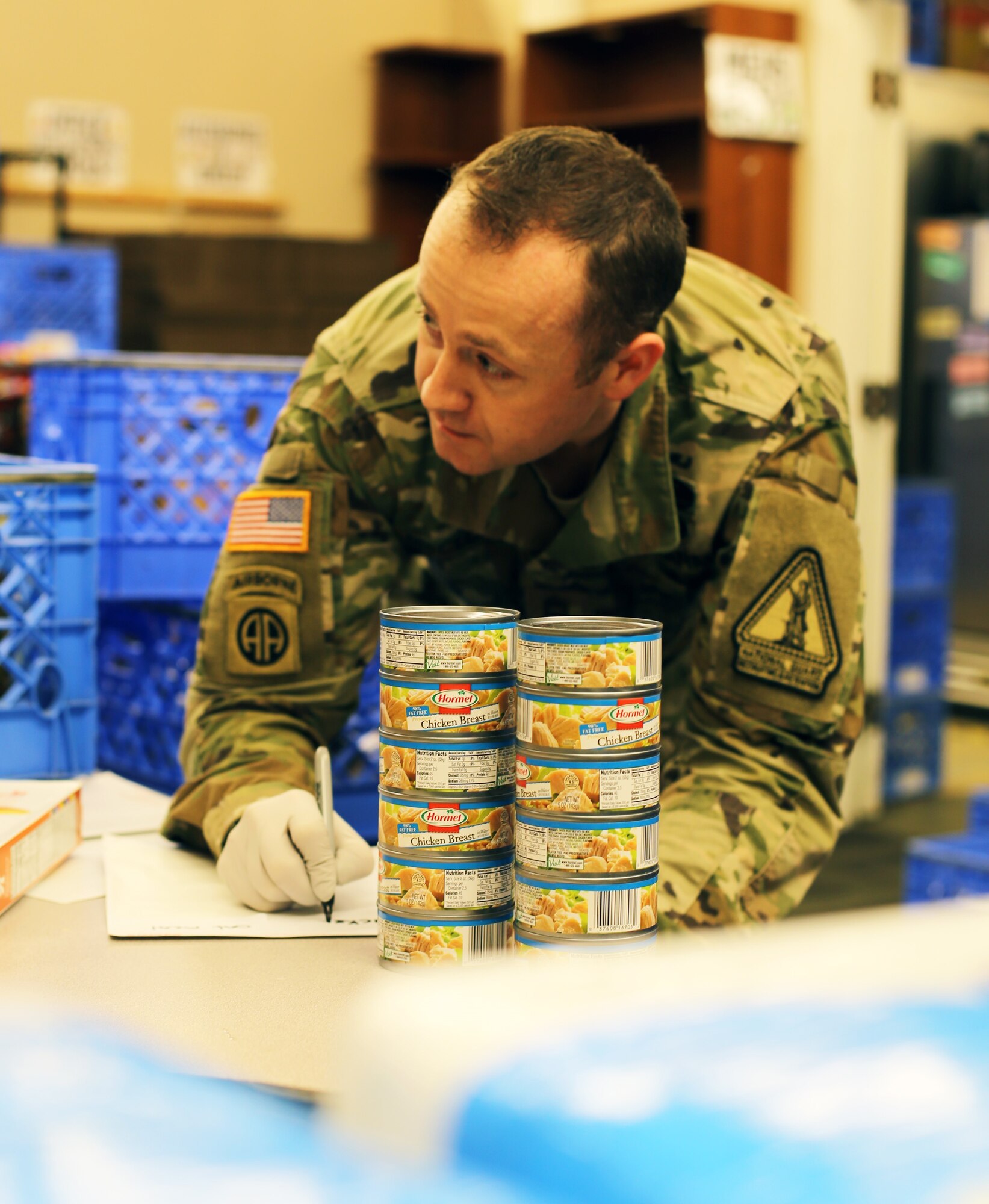 Master Sgt. Dustin McClure, Washington Army National Guard Recruiting and Retention Battalion, inventories canned food at the Issaquah Food Bank in Issaquah, Wash., April 2, 2020. Members of the Washington Air and Army National Guard are supporting food banks around the state during the COVID-19 pandemic.