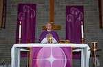 A Catholic priest oversees Ash Wednesday services.