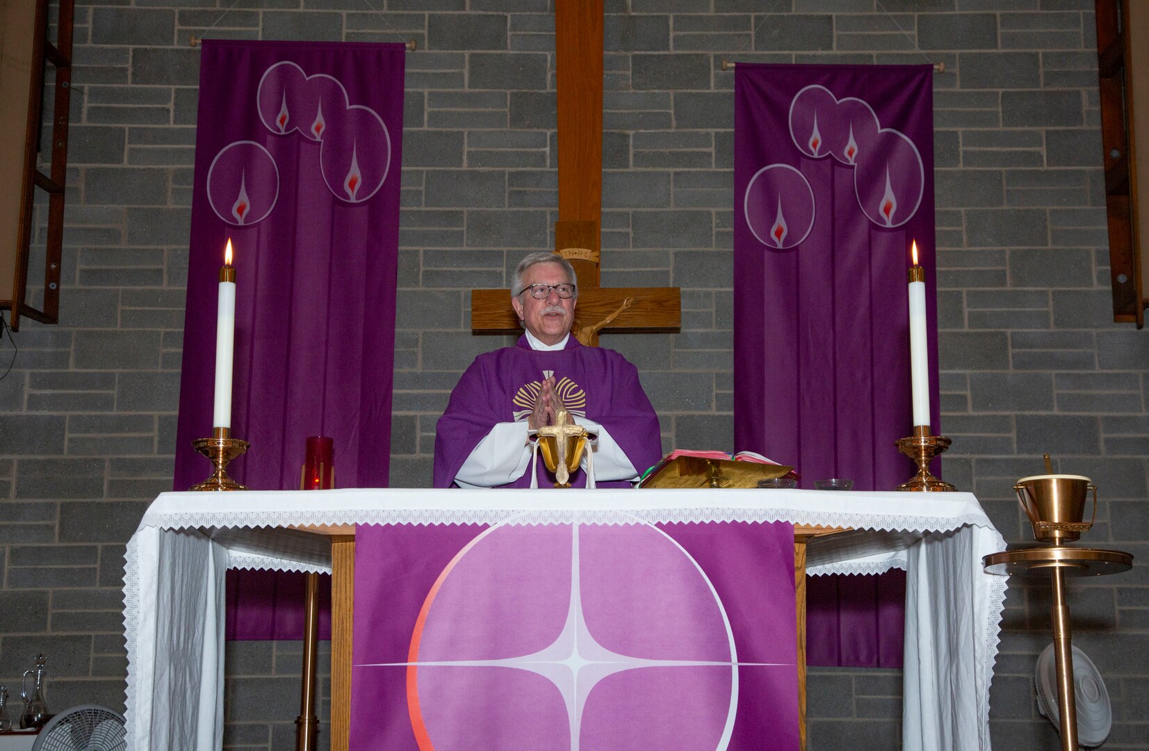 A Catholic priest oversees Ash Wednesday services.