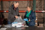 Code 530 Division Head Jimmy Broom (Left) and NNSY’s Supply Department (Code 500) Pier Master Jean Heitzman puts together a sanitizing cleaning kit that will be distributed to shops and codes across NNSY.