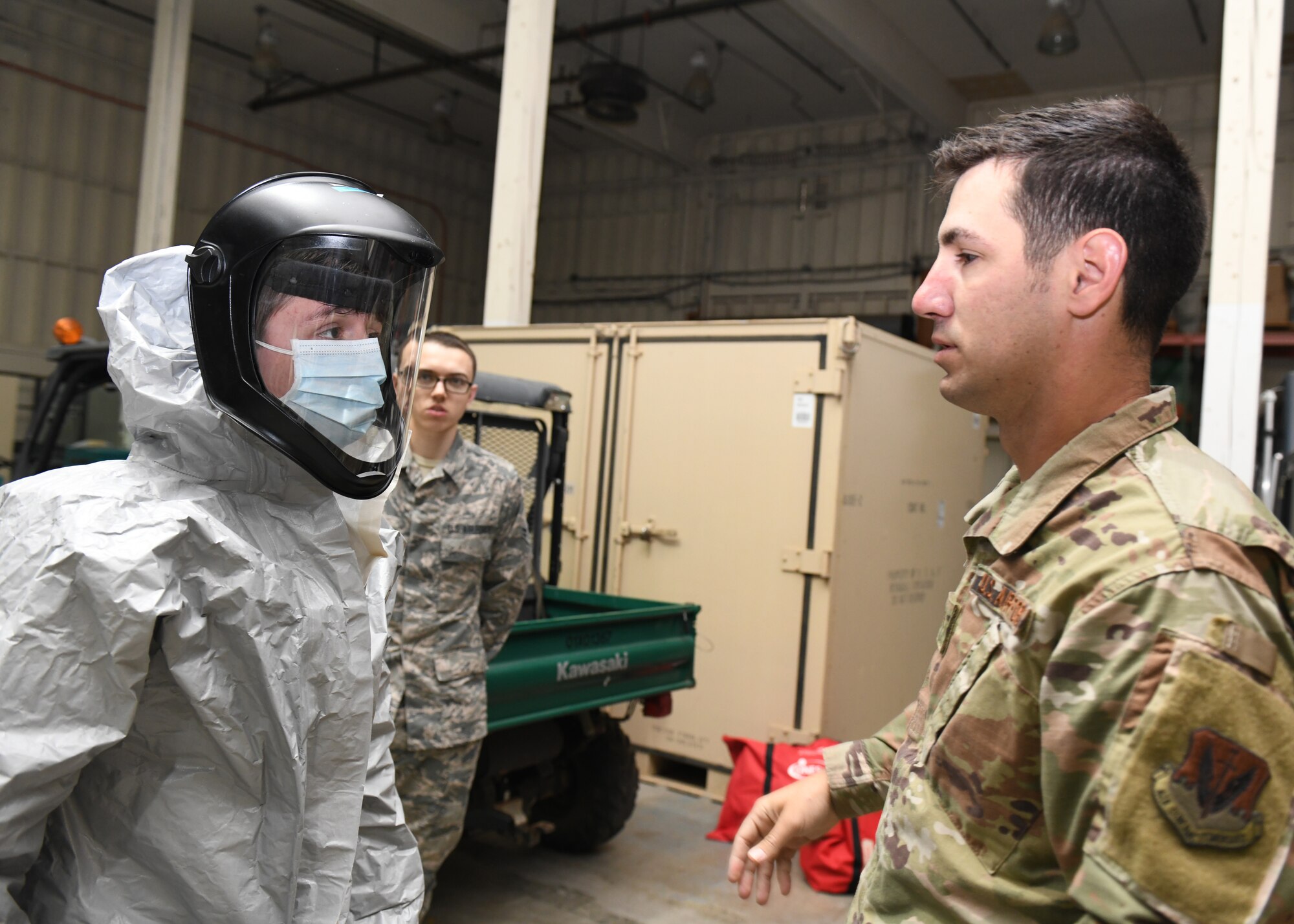 Senior Airman Dennis McAnnally, 9th Operational Medical Readiness Squadron Bioenviromental Engineering technician, right, inspects an Airman’s personal protective equipment (PPE), Mar. 28, 2020 at Beale Air Force Base, California. The training provided hands-on experience on properly donning PPE. (U.S. Air Force photo by Airman Luis A. Ruiz-Vazquez)