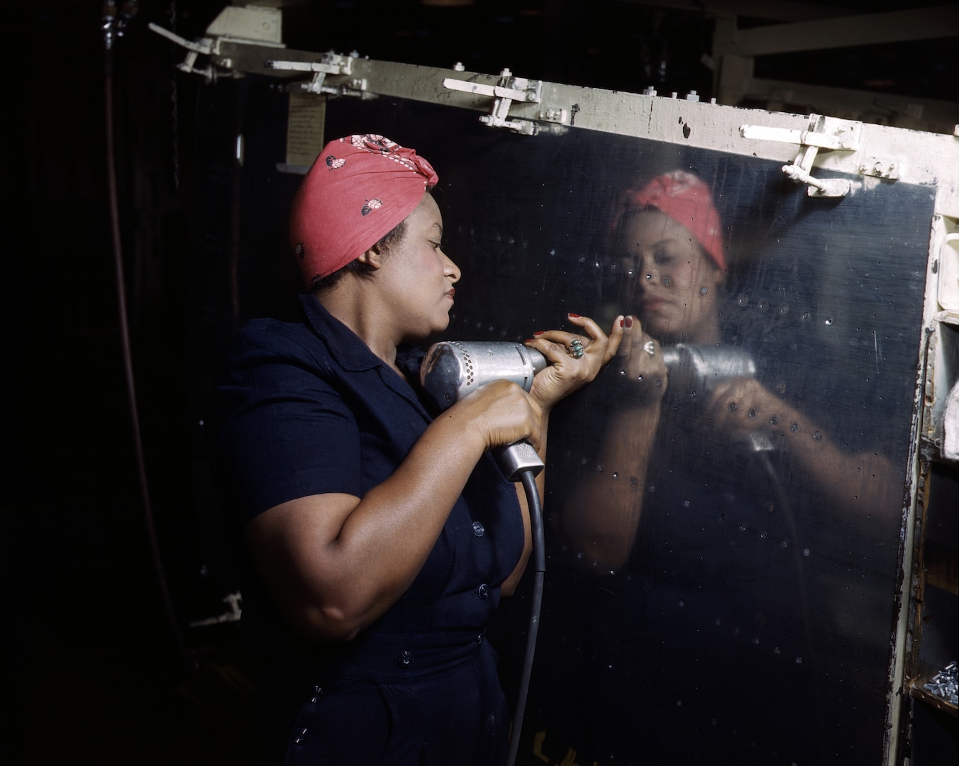 Woman operates hand drill