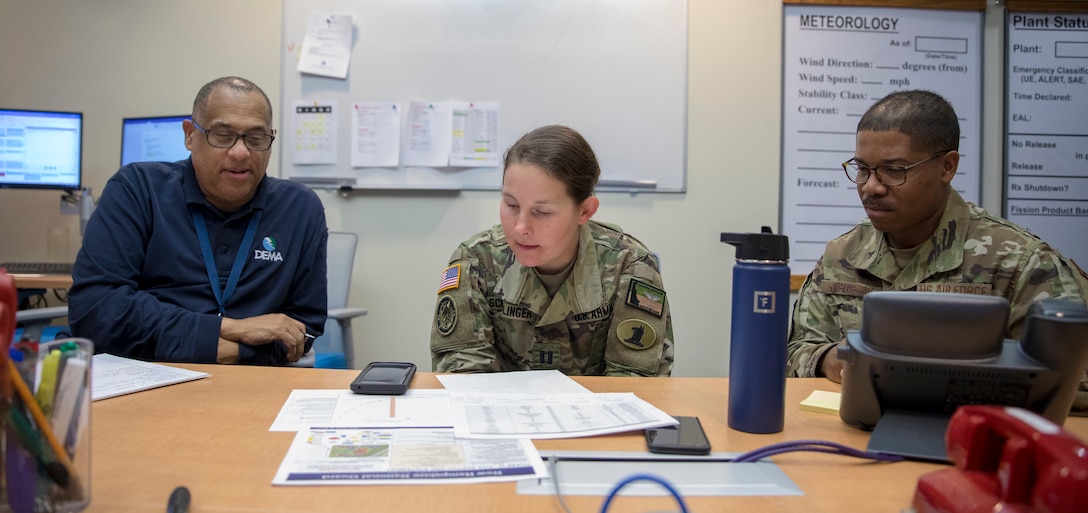 A team of the Delaware National Guard Airmen and Soldiers in partnership with the U.S. Army Corps of Engineers Philadelphia District, work with the Delaware Emergency Management Agency to provide support to the COVID-19 pandemic planning efforts, at the DEMA headquarters, Smyrna, Del., March 27, 2020. (U.S. Army National Guard (Photo by Sgt. Laura Michael.)