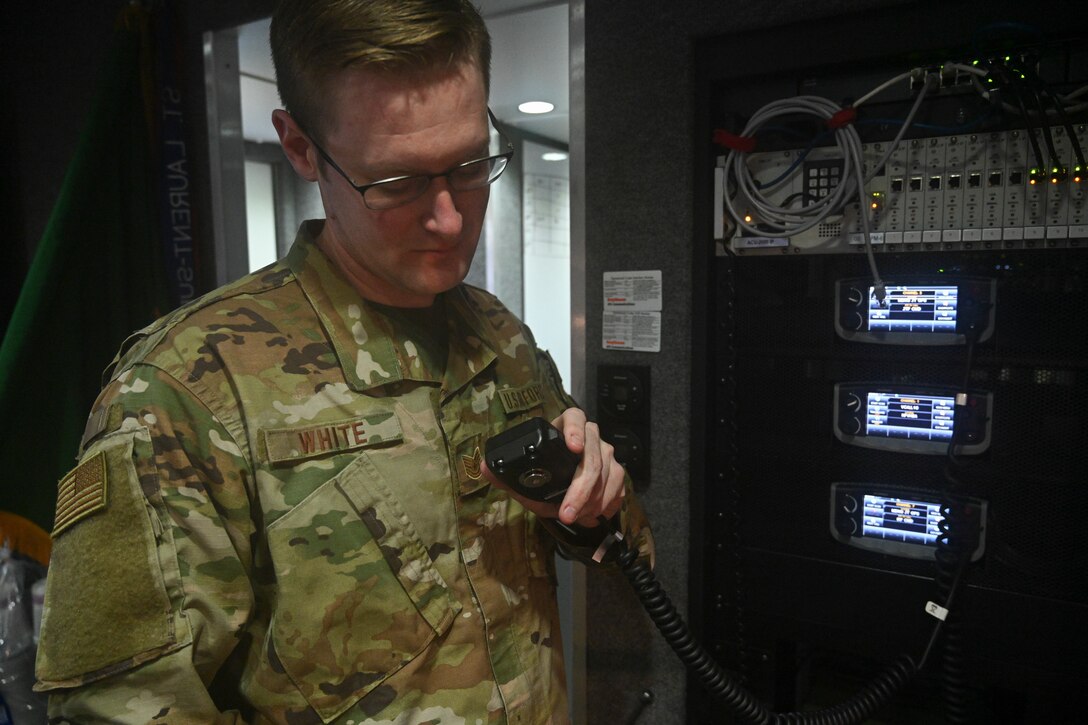 Tech. Sgt. Derek White, an emergency manager assigned to the 175th Emergency Management Flight, Maryland Air National Guard, ensures radio communication is properly functioning while deployed to FedEx Field in support of Prince George’s County Department of Health’s efforts to setup a COVID-19 medical screening center in Landover, Maryland. The 175th Wing Emergency Management Flight is the first Air National Guard unit to respond nationally providing support with its Mobile Emergency Operations Center to setup a temporary medical facility for the virus.(U.S. Air National Guard photo by Staff Sgt. Enjoli Saunders)