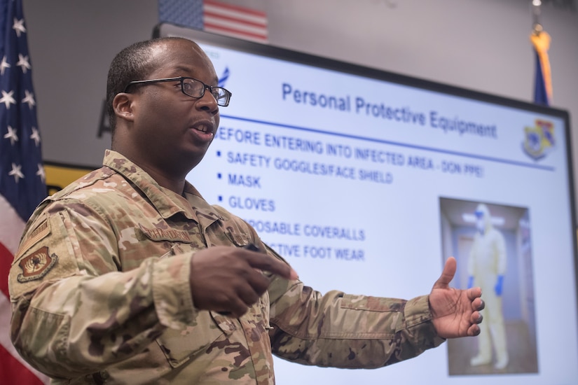 Staff Sgt. Myren Richardson, 437th Maintenance Group aircraft maintenance instructor, teaches students how to put on and remove personal protective equipment during a C-17 COVID-19 Decontamination Course at Joint Base Charleston, S.C., April 2, 2020. Members of the 437th MXG began implementation of the course March 28, 2020 to help ensure the safety of maintainers, aerial port personnel, aircrew and passengers while continuing support of Air Mobility Command’s rapid global mobility mission during the global pandemic.