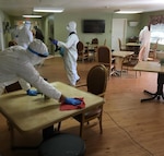 Georgia Army National Guard Soldiers of the Cordele-based Company C, 2nd Battalion, 121st Infantry Regiment, disinfect common areas in a long-term care facility in Dawson, Ga., April 2, 2020.