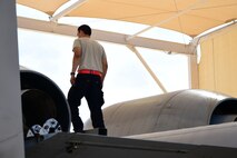 A photo of an airman working on the flight line