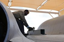 A photo of an airman working on the flight line