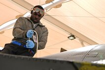 A photo of an airman working on the flight line