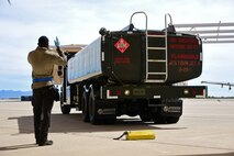 A photo of an airman working on the flight line