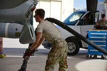A photo of an airman working on the flight line