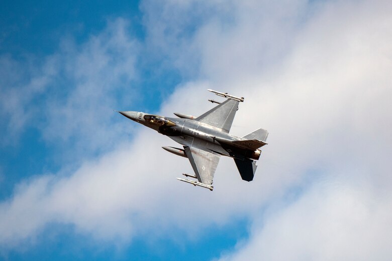 An F-16 Fighting Falcon performs a flyby maneuver