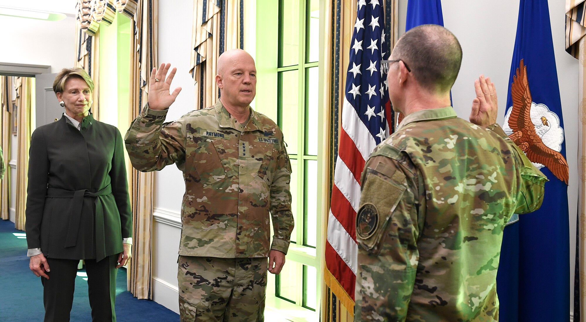 With Secretary of the Air Force Barbara Barrett looking on, U.S. Space Force Chief of Space Operations Gen. John W. Raymond administers the U.S. Space Force oath of enlistment to Chief Master Sgt. Roger A. Towberman, Pentagon, Arlington, Va. April 3, 2020. Towberman will serve as the senior enlisted advisor to the Chief of Space Operations and Secretary of the Air Force on all issues regarding the welfare, readiness, morale, proper utilization and progress of the Space Force enlisted force and their families. (U.S. Air Force photo by Andy Morataya)