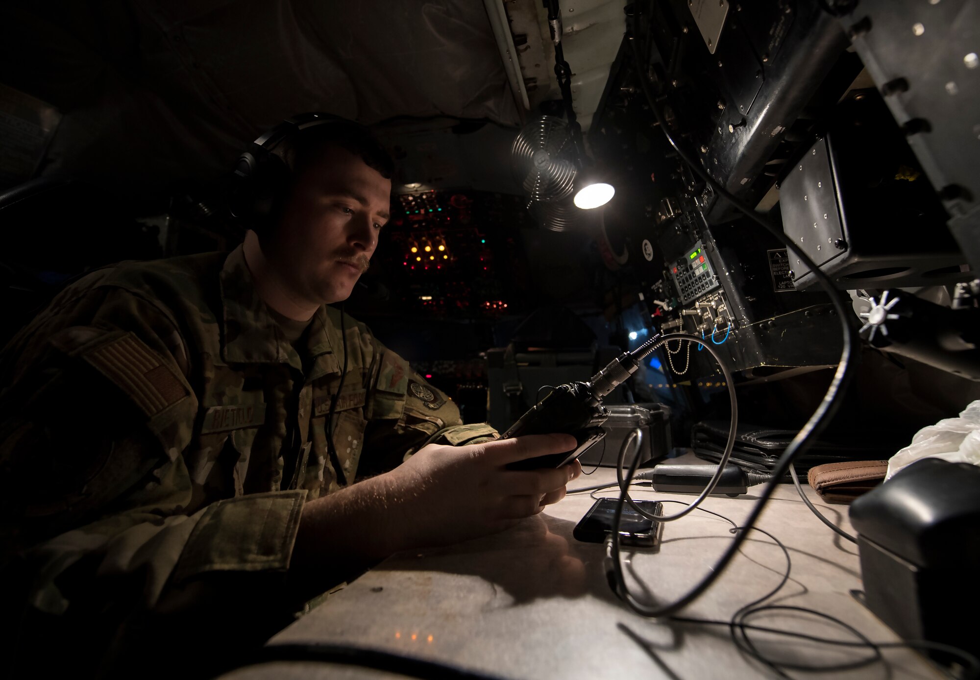 U.S. Air Force Airman 1st Class Paul Rietveld a 28th Expeditionary Air Refueling Squadron in-flight refueling specialist, conducts a preflight check inside a KC-135 Stratotanker at Al Udeid Air Base, Qatar, Feb. 6, 2020.