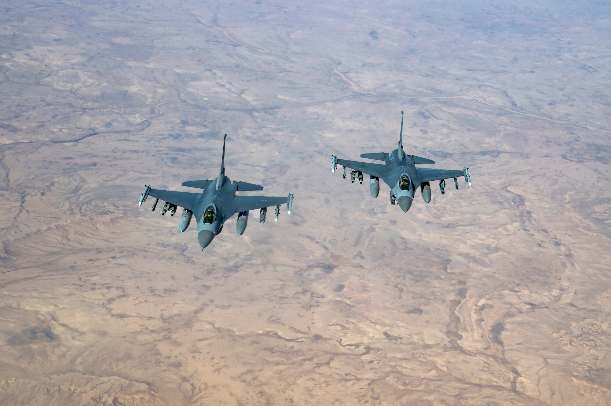 Two U.S. Air Force F-16 Fighting Falcons assigned to the 555th Expeditionary Fighter Squadron, fly over Iraq, Feb. 6, 2020.