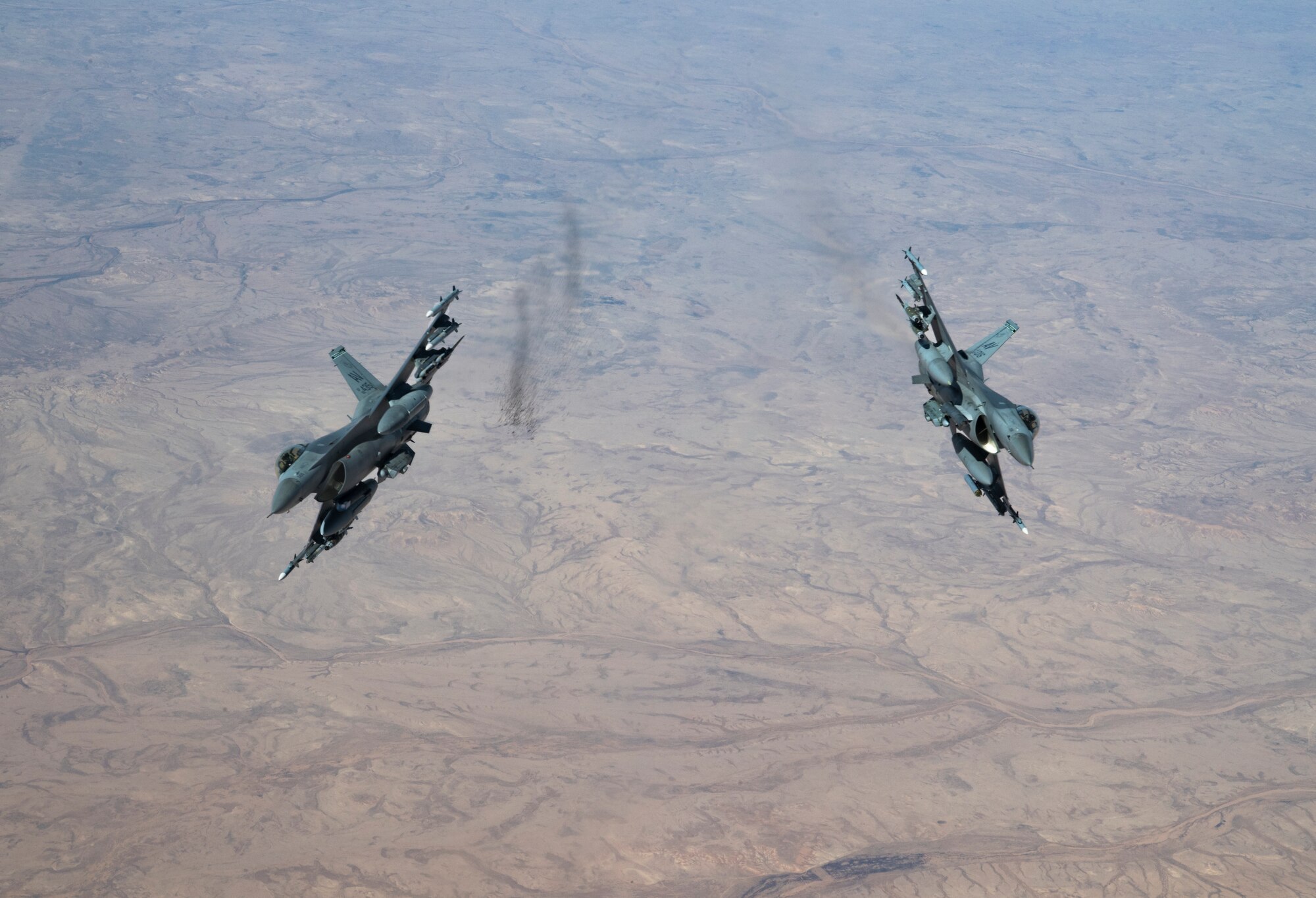 Two U.S. Air Force F-16 Fighting Falcons assigned to the 555th Expeditionary Fighter Squadron, fly over Iraq, Feb. 6, 2020.