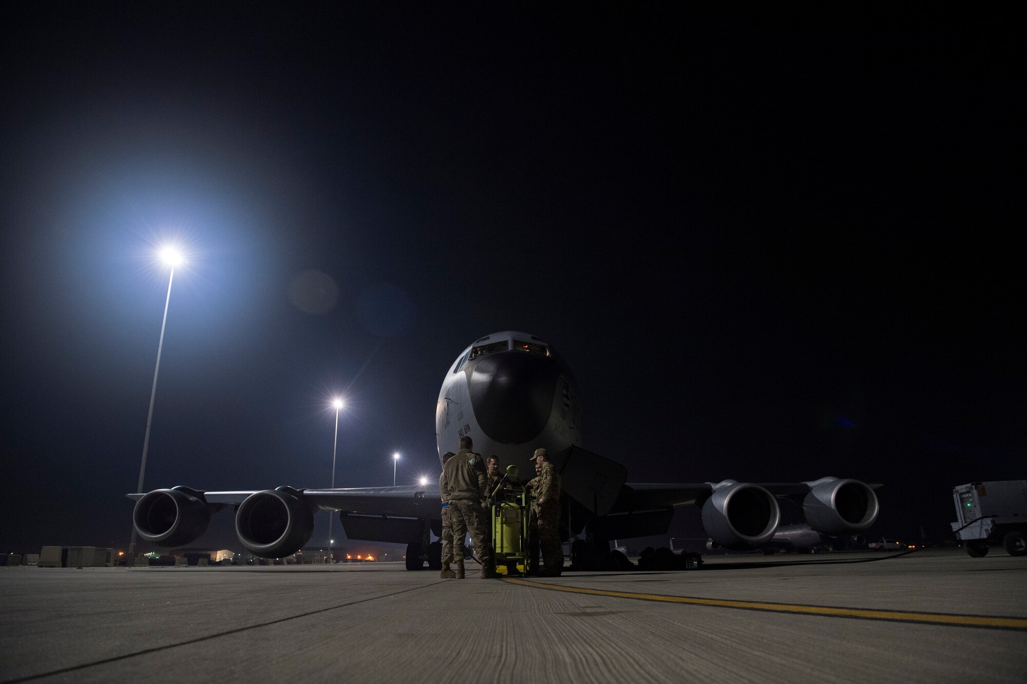 U.S. Air Force Airmen assigned to the 28th Expeditionary Air Refueling Squadron, conduct a preflight brief outside of a KC-135 Stratotanker at Al Udeid Air Base, Qatar, Feb. 6, 2020.