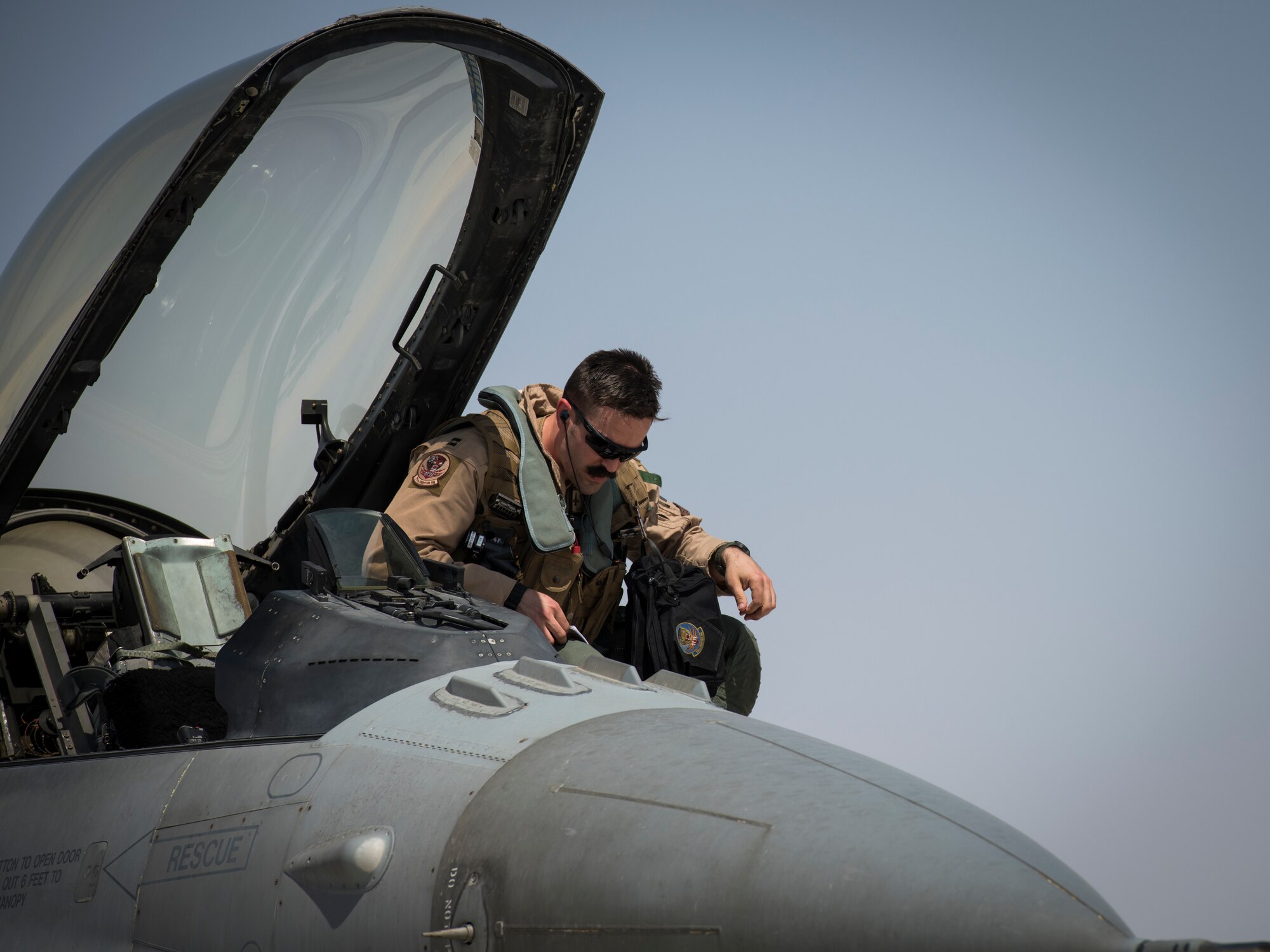U.S. Air Force Capt. Bill Garlisi, an F-16 “Viper” Fighting Falcon pilot with the 79th Expeditionary Fighter Squadron, departs an F-16 at an undisclosed location in the U.S. Central Command area of responsibility, Feb. 14, 2020.