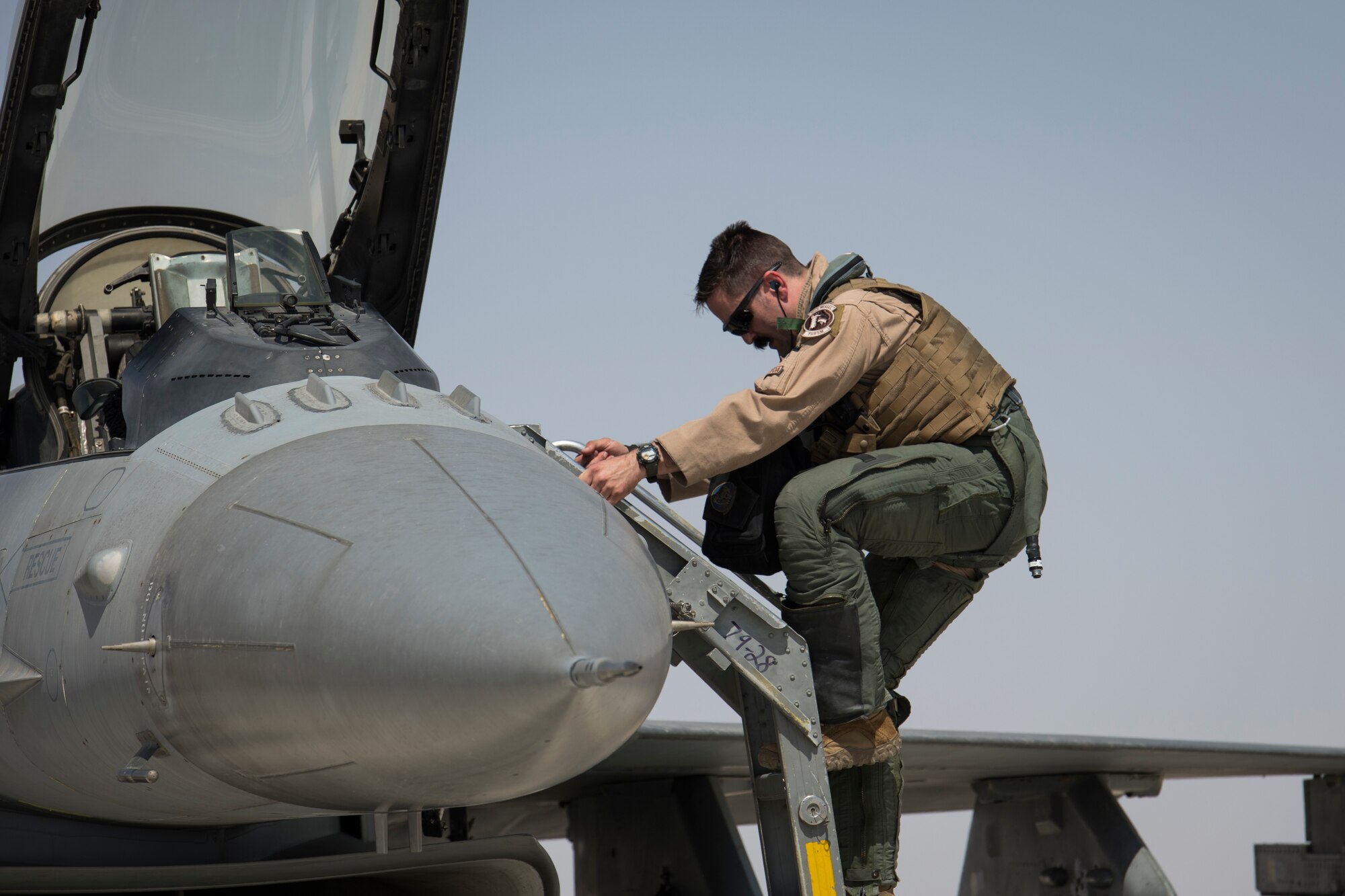 U.S. Air Force Capt. Bill Garlisi, an F-16 “Viper” Fighting Falcon pilot with the 79th Expeditionary Fighter Squadron, departs an F-16 at an undisclosed location in the U.S. Central Command area of responsibility, Feb. 14, 2020.