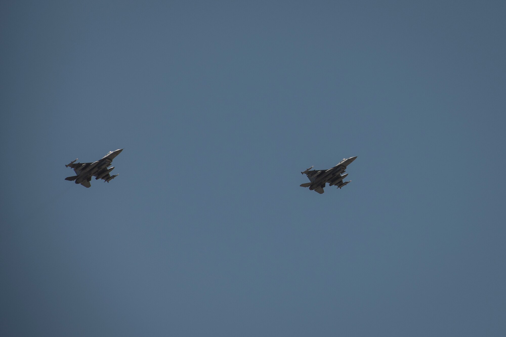 Two U.S. Air Force F-16 “Viper” Fighting Falcons assigned to the 79th Expeditionary Fighter Squadron fly above an undisclosed location in the U.S. Central Command area of responsibility, Feb. 14, 2020.