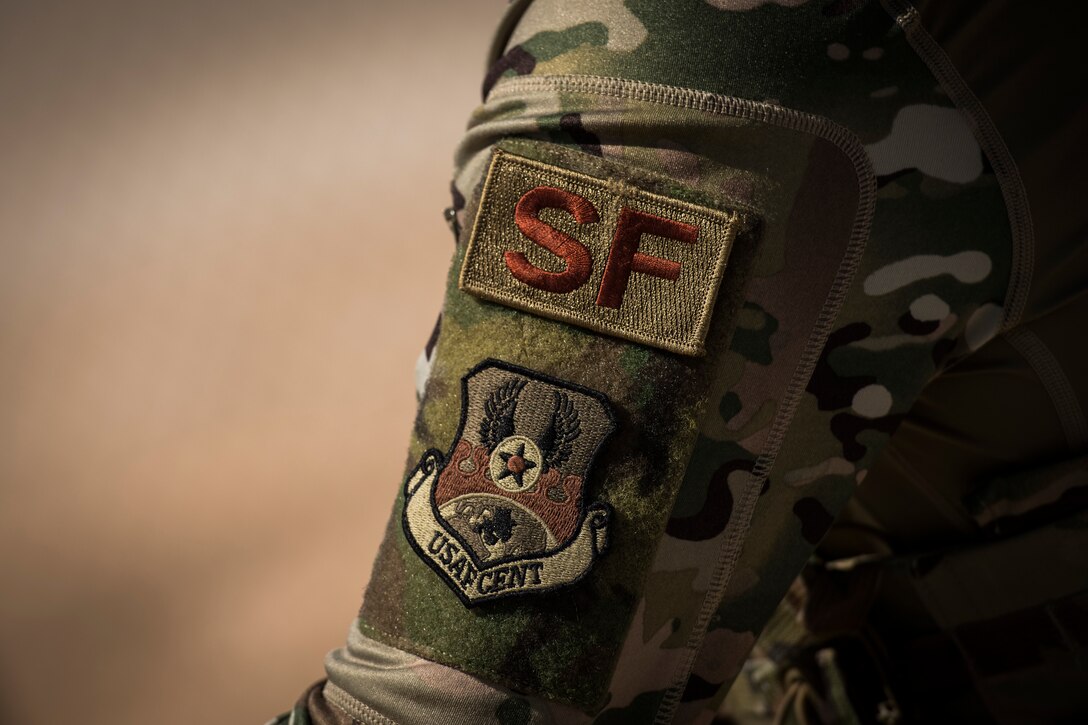 U.S. Air Force Airman Brec Voges, a security forces member with the 379th Expeditionary Security Forces Squadron, opens an entry control point at an undisclosed location in the U.S. Central Command area of responsibility, Feb. 18, 2020.