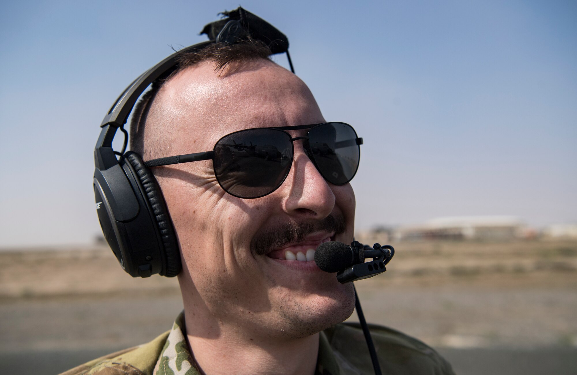 A U.S. Air Force loadmaster assigned to the 779th Expeditionary Airlift Squadron, smiles to his C-130H Hercules crew at Ali Al Salem Air Base, Kuwait, Feb. 20, 2020.
