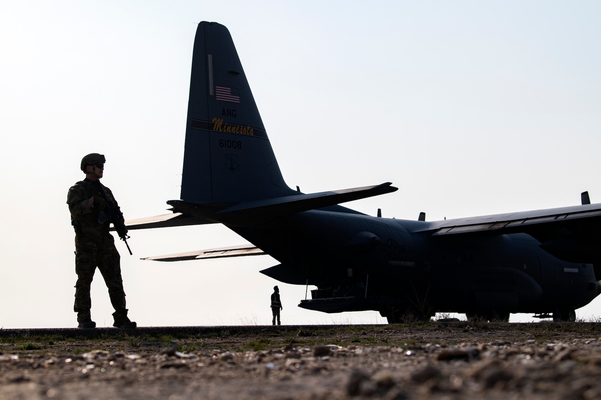 A U.S. Air Force Security Forces Raven assigned to the 779th Expeditionary Airlift Squadron, guards a C-130H Hercules during a cargo pickup in Iraq, Feb. 20, 2020.