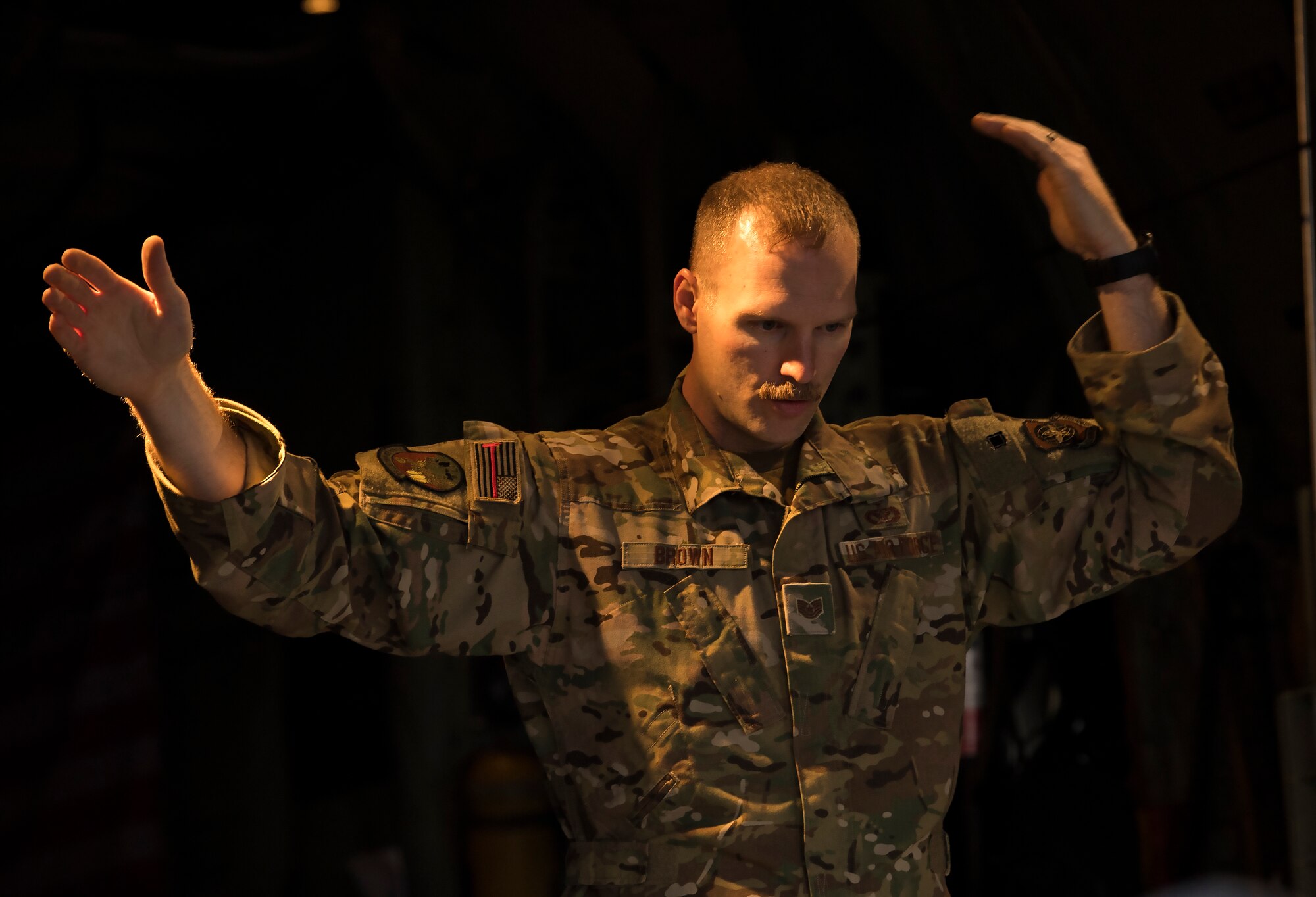A U.S. Air Force loadmaster assigned to the 779th Expeditionary Airlift Squadron, guides cargo onto a C-130H Hercules at Ali Al Salem Air Base, Kuwait, Feb. 20, 2020.