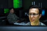 U.S. Air Force Maj. Robert Duluca, Maryland National Guard Joint Task Force Cyber operations officer, poses for a photo April 3, 2020, at the 175th Wing at Warfield Air National Guard Base, Middle River, Md.