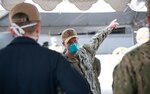 U.S. Navy Vice Adm. Bill Merz, commander, U.S. 7th fleet, addresses Carrier Strike Group Nine warfare commanders on the pier in Naval Base Guam April 5, 2020. Merz arrived in Guam to assess and support the ongoing COVID-19 recovery efforts for the crew of Theodore Roosevelt. Theodore Roosevelt is in Guam for a scheduled port visit for resupply and crew rest during their scheduled deployment to the Indo-Pacific.