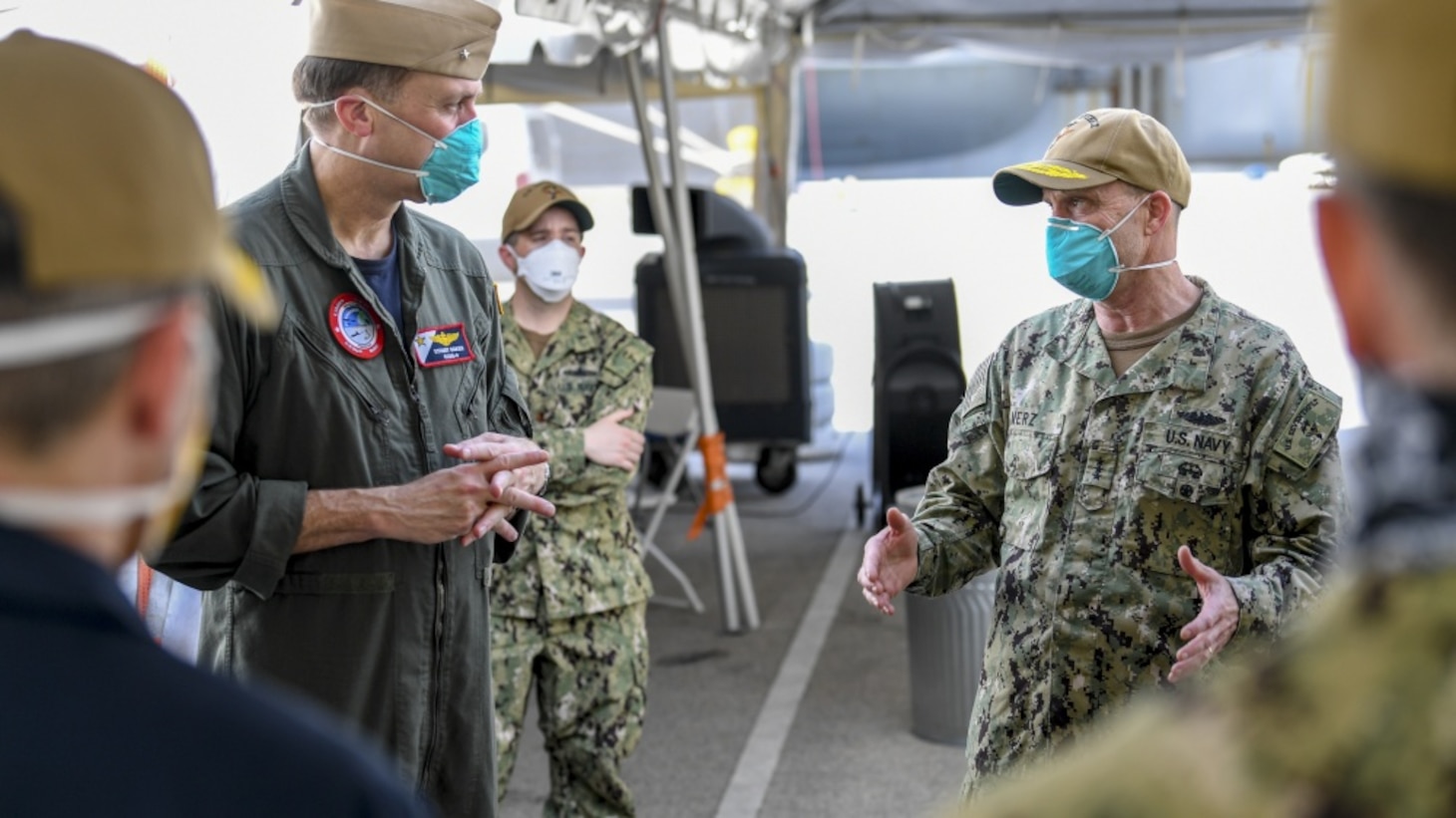 Vice Admiral Bill Merz, commander, U.S. 7th Fleet, meets with the staff and crew of the aircraft carrier USS Theodore Roosevelt (CVN 71), April 5. Merz arrived in Guam to assess and support the ongoing COVID-19 recovery efforts for the crew of Theodore Roosevelt.