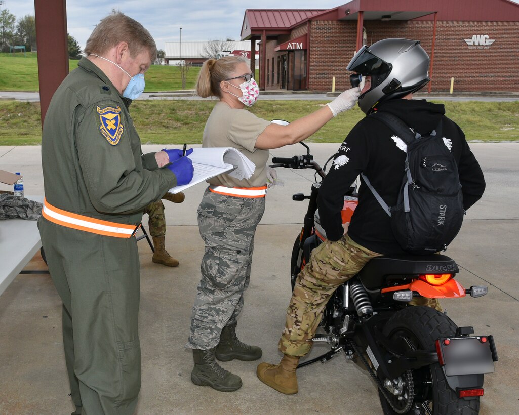 Medical staff of the 117th Air Refueling Wing Medical Group perform manditory screenings of personnel prior to entry to the 117th Air Refueling Wing, Sumpter Smith Joint National Guard Base, Birmingham, Alabama during the COVID 19 outbreak March 27, 2020. (U.S. Air National Guard photo by Ken Johnson)