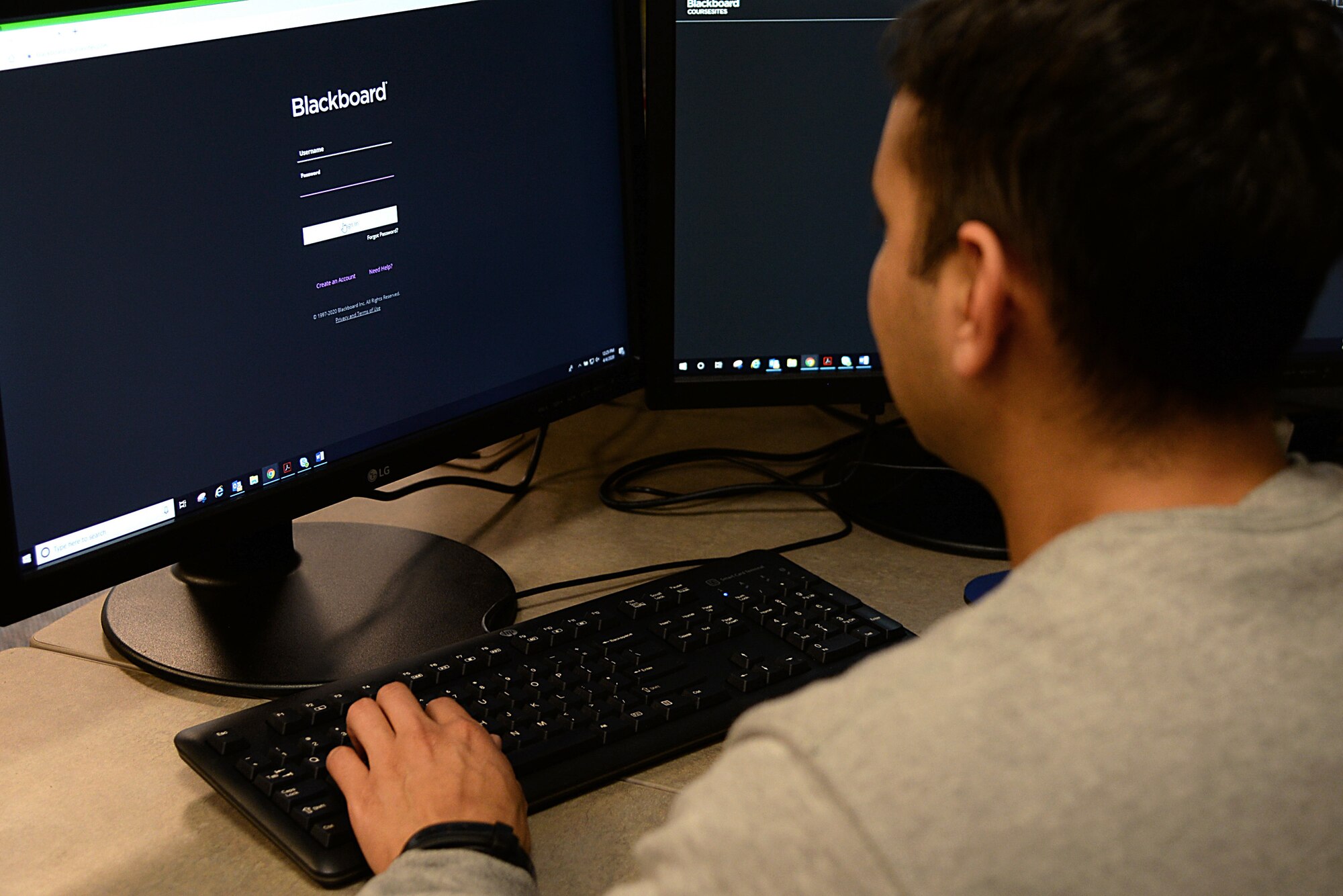 An image of a 177th Fighter Wing unit member utilizing a computer to accomplish training during a virtual Unit Training Assembly