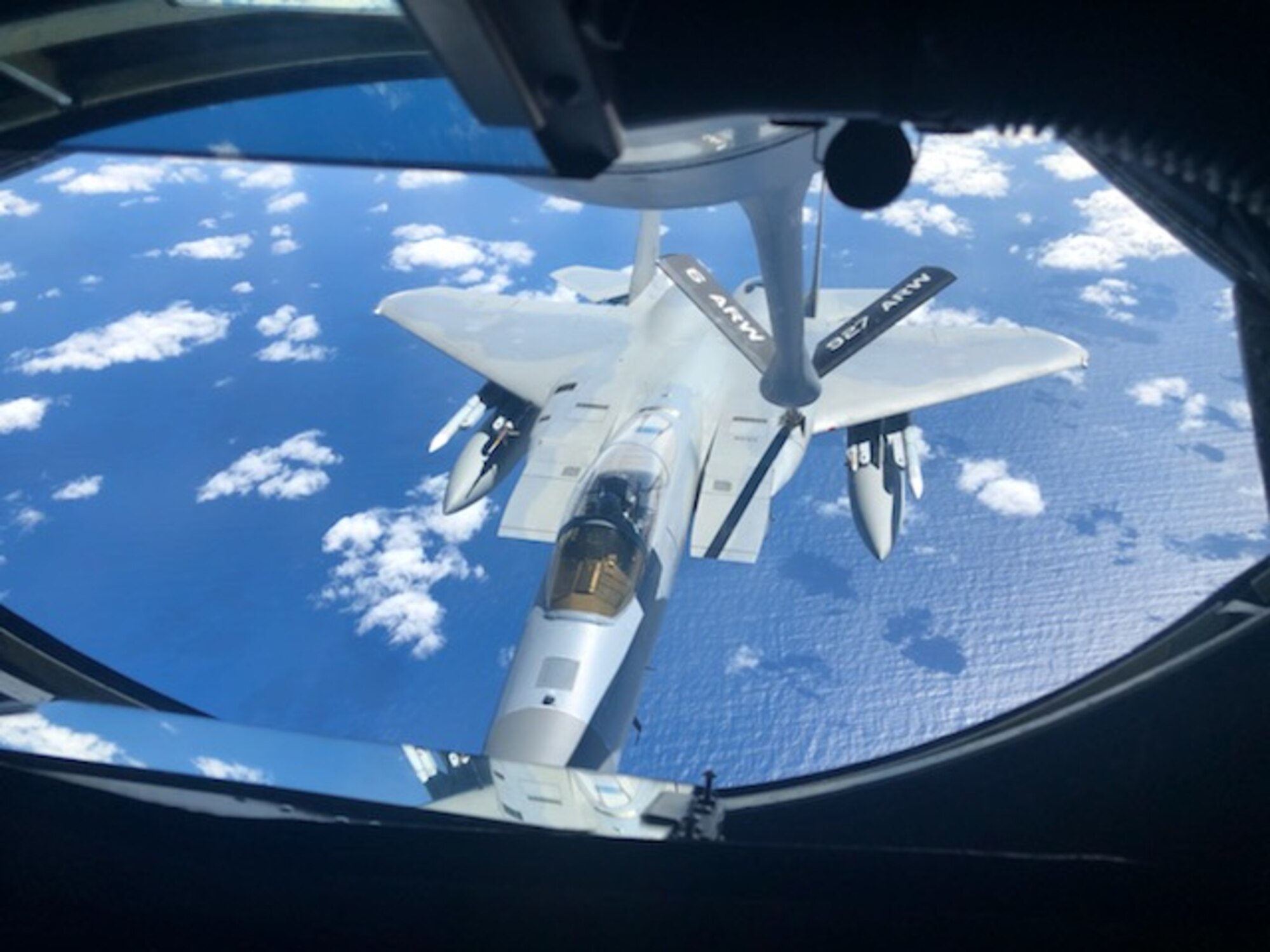 An F-15 connects with the refueling boom and can be seen through the boom operator’s window of a KC-135 that is flown by Reserve Airmen from the 63rd Air Refueling Squadron based at MacDill AFB, Fla. April 2, 2020.  (U.S. Air Force Photo by 1Lt Clayton Gledhill)