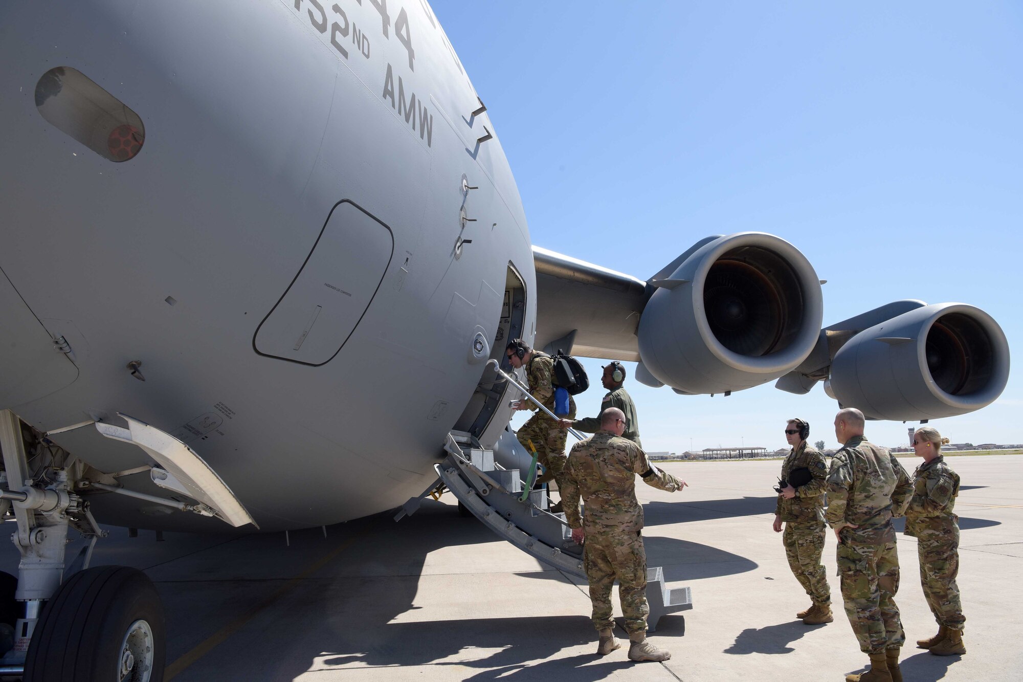 Mobilized Air Force Reserve medics board a C-17 in route to “hot zones” in support of the COVID-19 pandemic from Luke Air Force Base, Ariz., April 5, 2020. This deployment is part of a larger mobilization package of more than 120 doctors, nurses and respiratory technicians Air Force Reserve units across the nation provided over the past 48 hours in support of the COVID-19 response to take care of Americans. The C-17 is deployed from March Air Force Base, Calif.