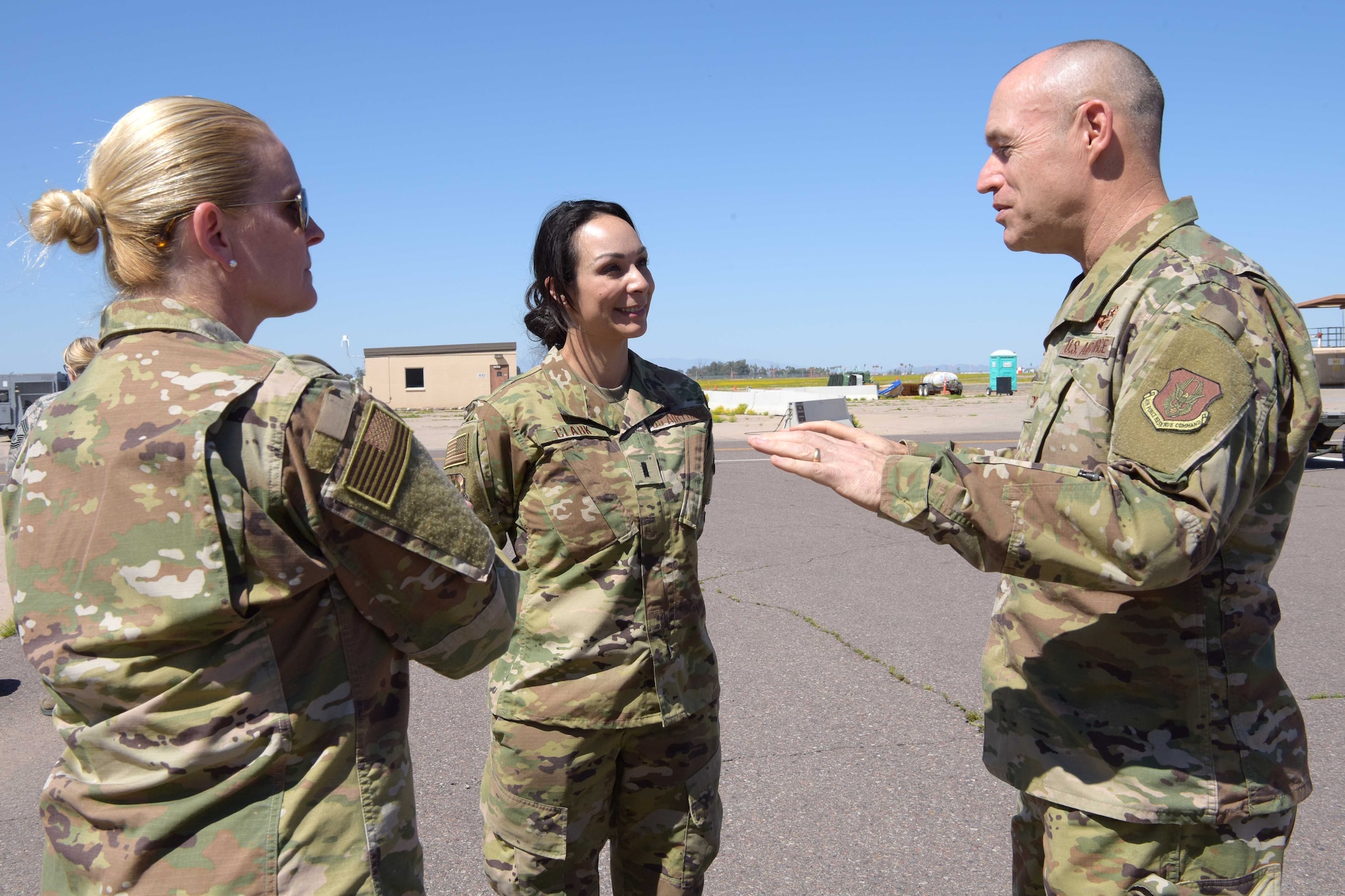 1st Lt. Danielle Clark, 944th Aeromedical Staging Squadron clinical nurse, talks with the 944th Fighter Wing commander, Col. James Greenwald, as the 944 FW Command Chief, Chief Master Sgt. Catherine Buchanan, listens in before Clark departs in support of the COVID-19 pandemic at Luke Air Force Base, Ariz., April 5, 2020. This deployment is part of a larger mobilization package of more than 120 doctors, nurses, and respiratory technicians. Air Force Reserve units across the nation provided over the past 48 hours in support of the COVID-19 response to take care of Americans.