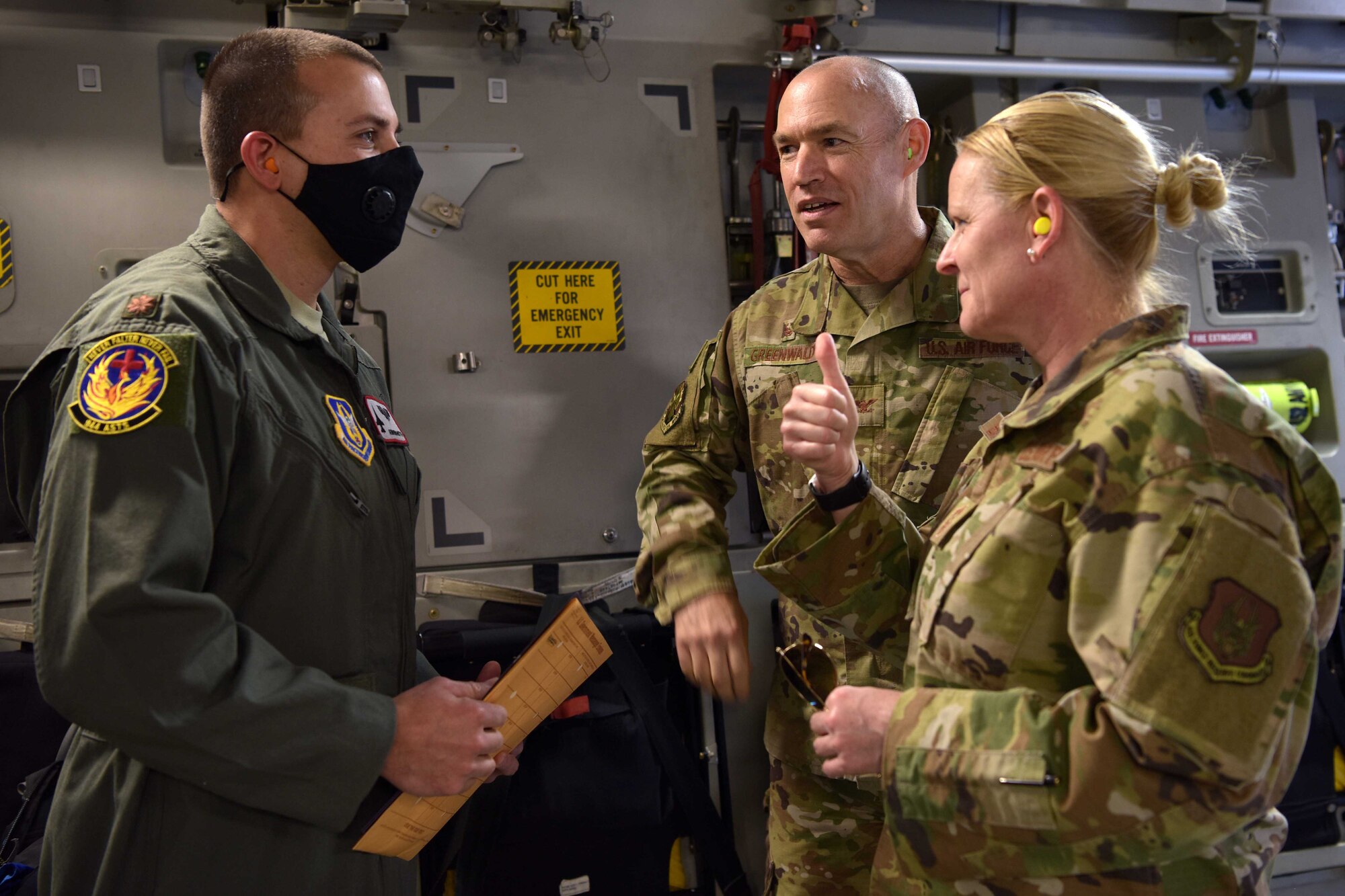 Major Avram Aaron Brammostyn, 944th Aeromedical Staging Squadron flight surgeon, checks in with the 944th Fighter Wing Commander, Col. James Greenwald, and the 944th FW Command Chief, Chief Master Sgt. Catherine Buchanan, before his takes off in support of the COVID-19 pandemic at Luke Air Force Base, Ariz., April 5, 2020. This deployment is part of a larger mobilization package of more than 120 doctors, nurses and respiratory technicians Air Force Reserve units across the nation provided over the past 48 hours in support of the COVID-19 response to take care of Americans.