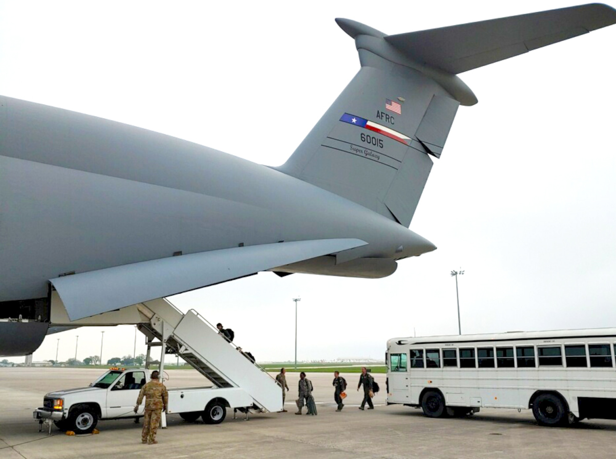 Reservists load into a C-5 Super Galaxy Aircraft to help support COVID-19 relief efforts.