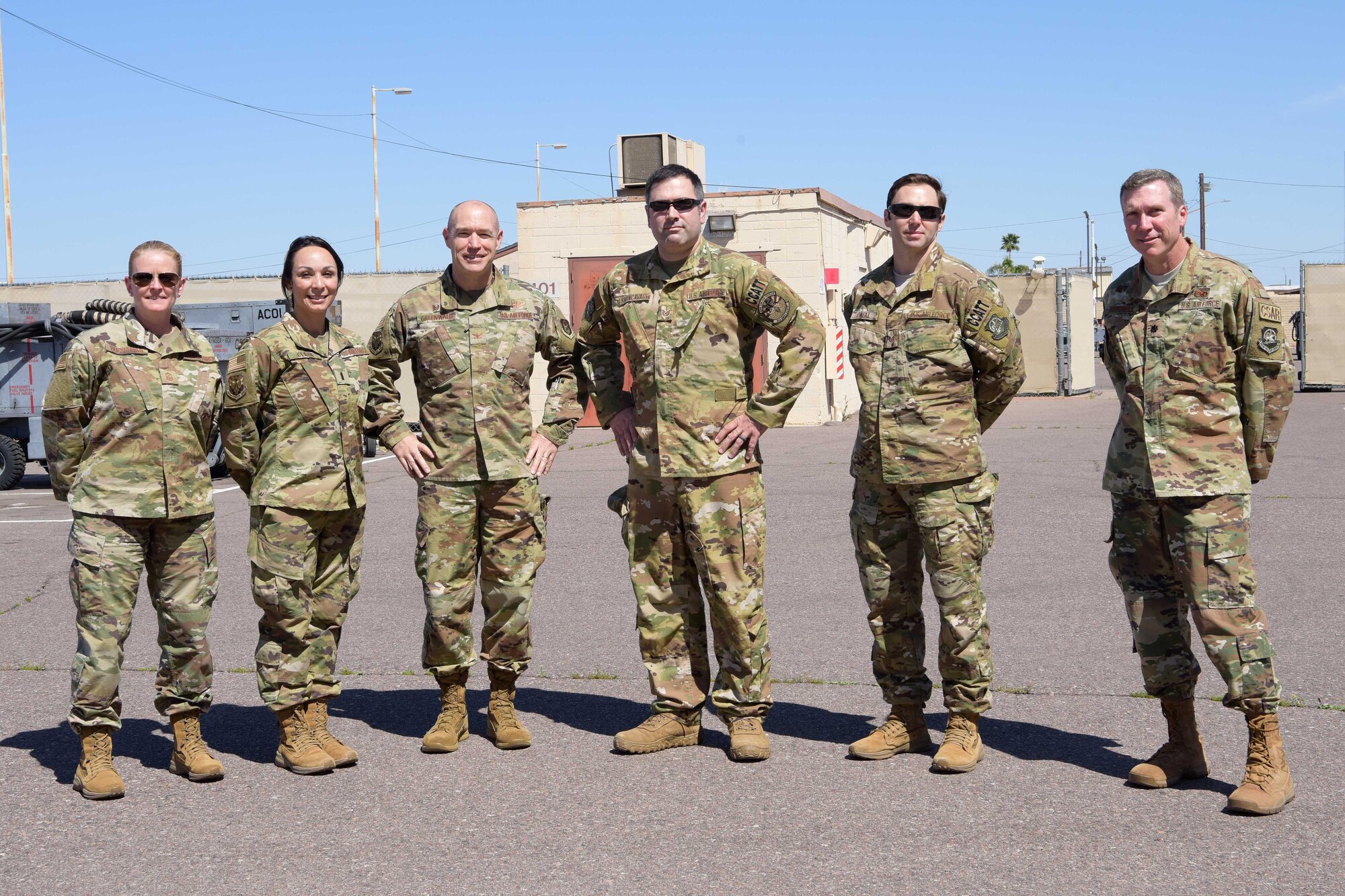 Mobilized Air Force Reserve medics pose for a photo with their leaderships before they board their airlift in support of the COVID-19 pandemic at Luke Air Force Base, Ariz., April 5, 2020. This deployment is part of a larger mobilization package of more than 120 doctors, nurses and respiratory technicians Air Force Reserve units across the nation provided over the past 48 hours in support of the COVID-19 response to take care of Americans.