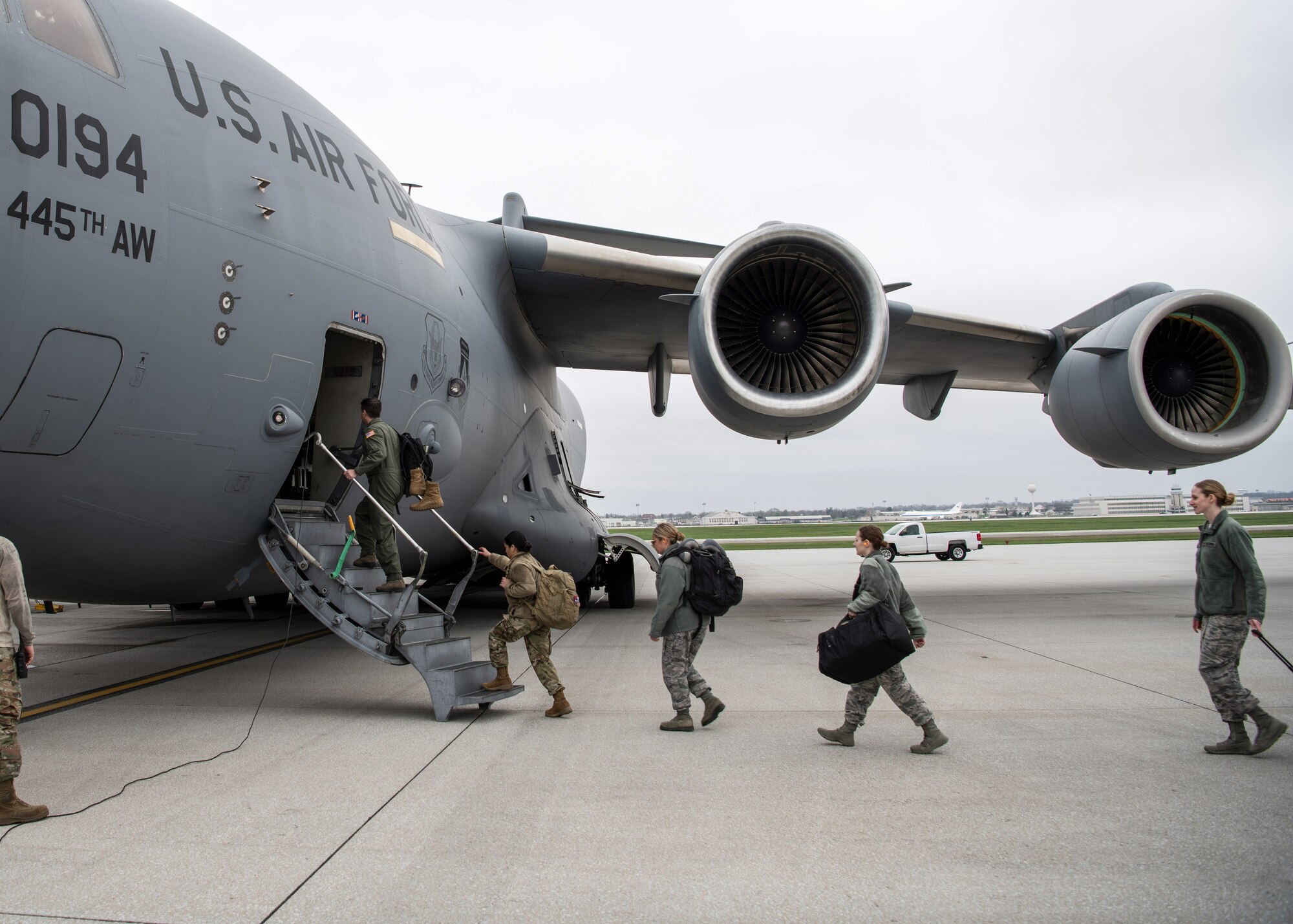 A doctor and several nurses from the 445th Airlift Wing’s Aerospace Medicine and Aeromedical Staging Squadrons, board a C-17 Globemaster III here April 5, 2020 heading to Joint Base McGuire-Dix-Lakehurst. The Airmen were notified April 4, 2020 that they would be mobilized to New York City to help with the COVID-19 pandemic. The Citizen Airmen will join other military personnel providing medical services at the Jacob Javits Center in New York City. This deployment is part of a larger mobilization package of more than 120 doctors, nurses and respiratory technicians Air Force Reserve units across the nation provided over the past 48 hours in support of COVID-19 response to take care of Americans. (U.S. Air Force photo/Mr. Patrick O’Reilly)