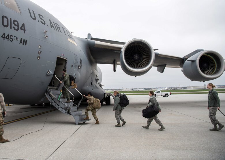 Medical professionals from the 445th Airlift Wing’s Aerospace Medicine and Aeromedical Staging Squadrons, board a C-17 Globemaster III at Wright-Patterson Air Force Base, Ohio, heading to Joint Base McGuire-Dix-Lakehurst in early April.  (Patrick O’Reilly)