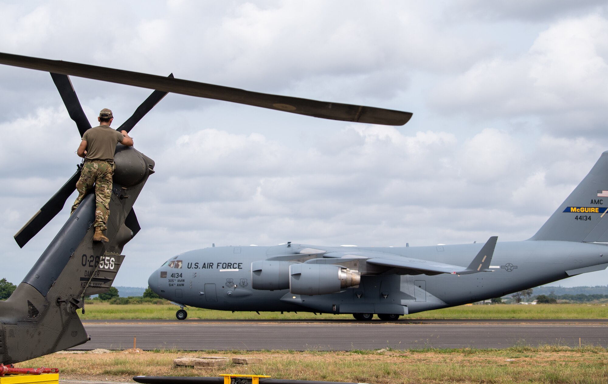 U.S. Army Sgt. Christian Villegas, 82nd Combat Aviation Brigade (CAB), 3rd Battalion crew chief, assembles the tail rotor blades of a UH-60L Blackhawk at Moi International Airport, Mombasa, Kenya on March 1, 2020.