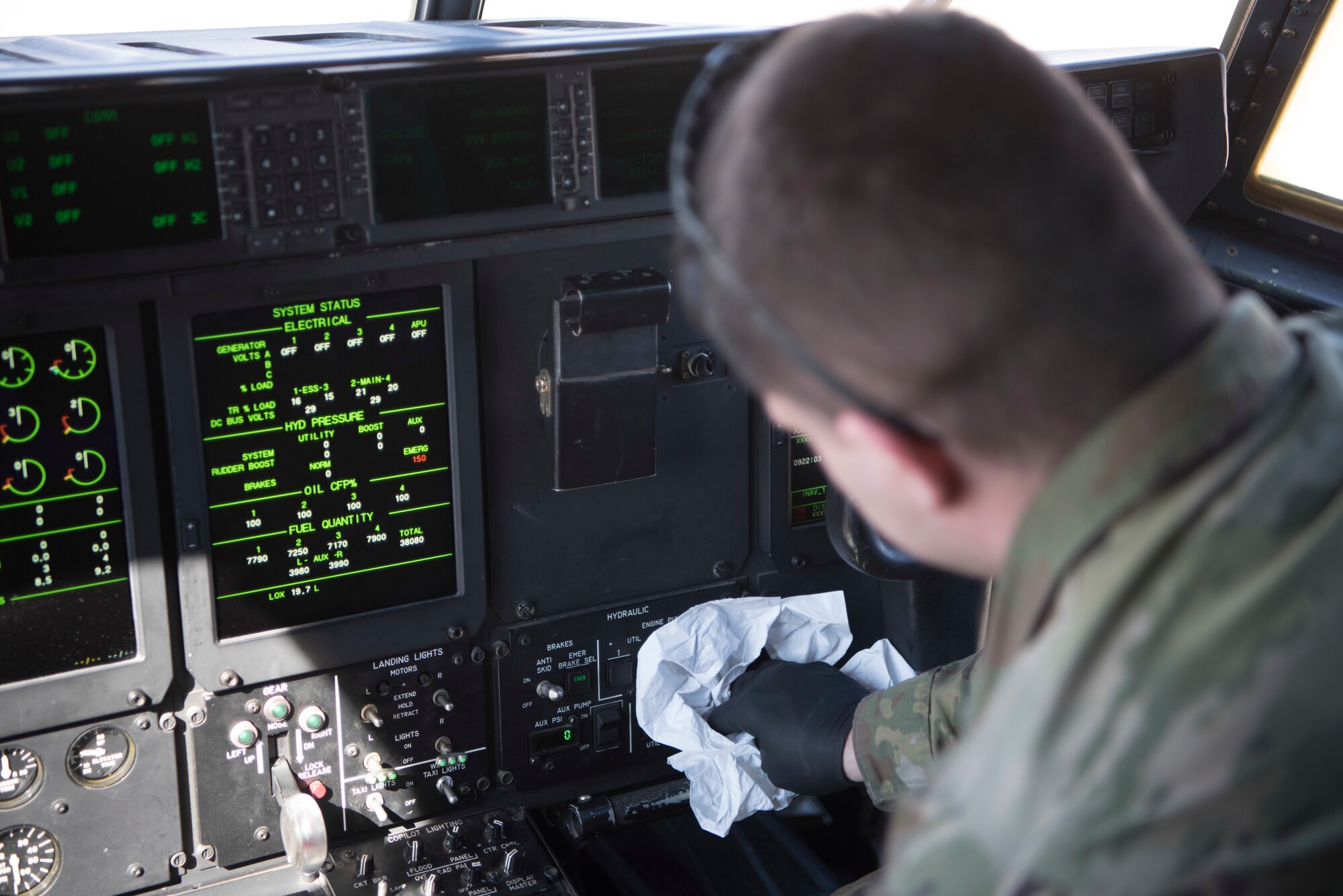 U.S. Air Force Senior Airman Kyle Hodge, 86th Aircraft Maintenance Squadron flying crew chief, wipes down hydraulic switches with a disinfectant solution on a C-130J Super Hercules aircraft, Ramstein Air Base, Germany, April 1, 2020. As concern over the coronavirus disease 2019 continued to emerge, the 86th AMXS implemented thorough disinfection procedures to ensure a minimum risk of exposure to the virus. (U.S. Air Force photo by Senior Airman Kristof J. Rixmann)