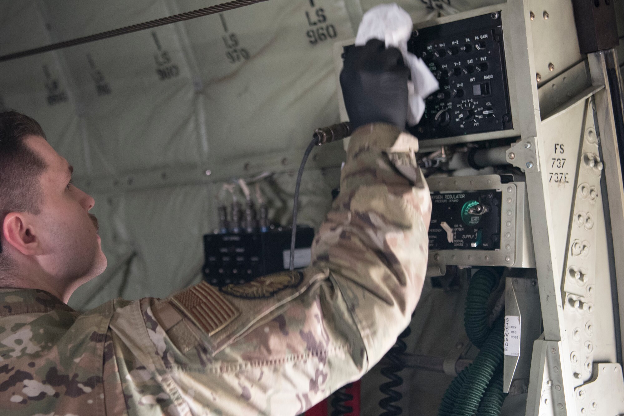 U.S. Air Force Senior Airman Kyle Hodge, 86th Aircraft Maintenance Squadron flying crew chief, wipes down a high-touch area of contact on a C-130J Super Hercules aircraft, Ramstein Air Base, Germany, April 1, 2020. As concern over the coronavirus disease 2019 continued to emerge, the 86th AMXS implemented thorough disinfection procedures to ensure a minimum risk of exposure to the virus. (U.S. Air Force photo by Senior Airman Kristof J. Rixmann)