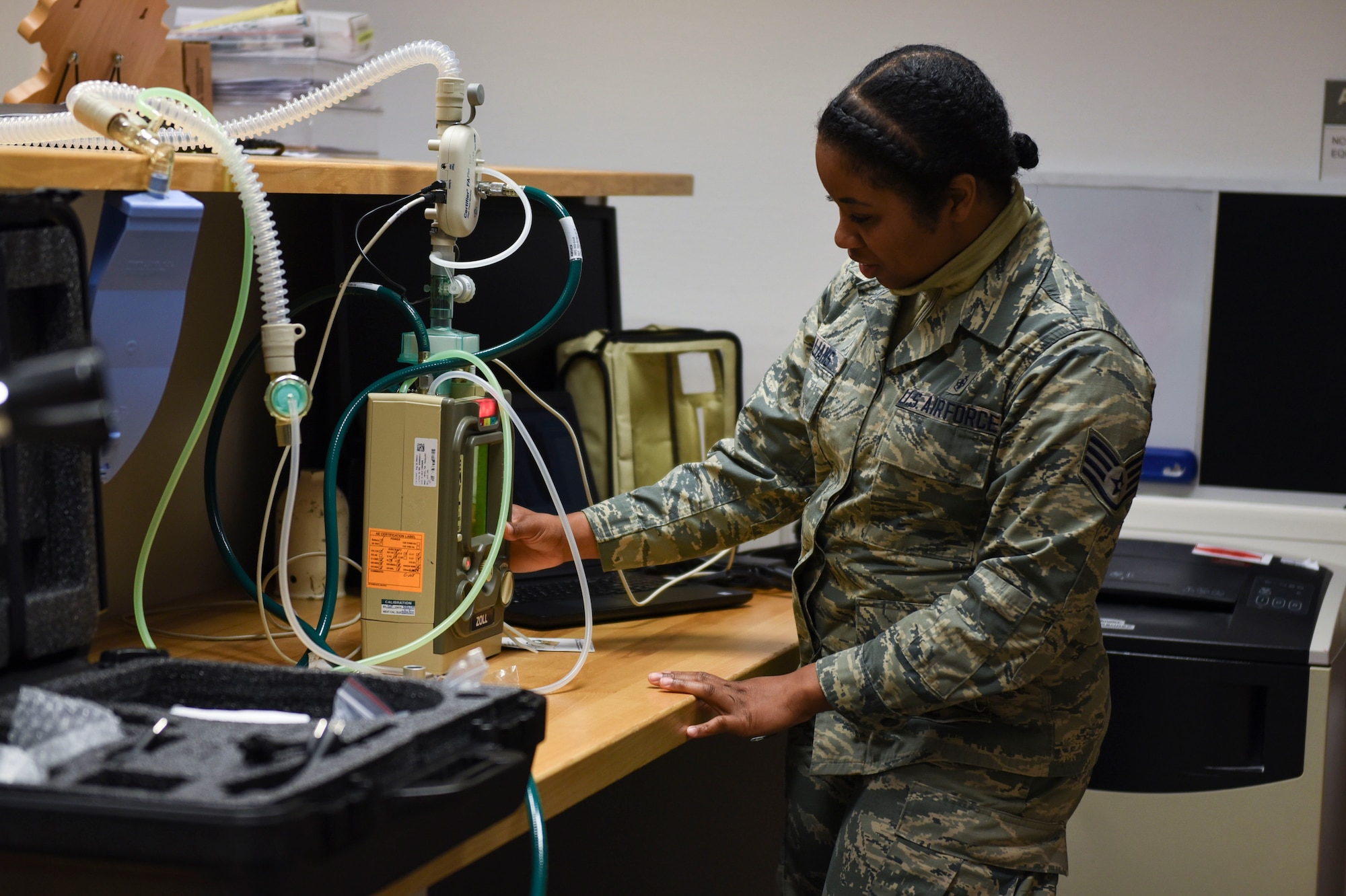 U.S. Air Force Staff Sgt. Neekia Williams, 52nd Medical Group biomedical equipment technician, inspects a ventilator at Spangdahlem Air Base, Germany, April 1, 2020. Williams ensures ventilators are working properly if needed for COVID-19 care. (U.S. Air Force photo by Senior Airman Melody W. Howley)