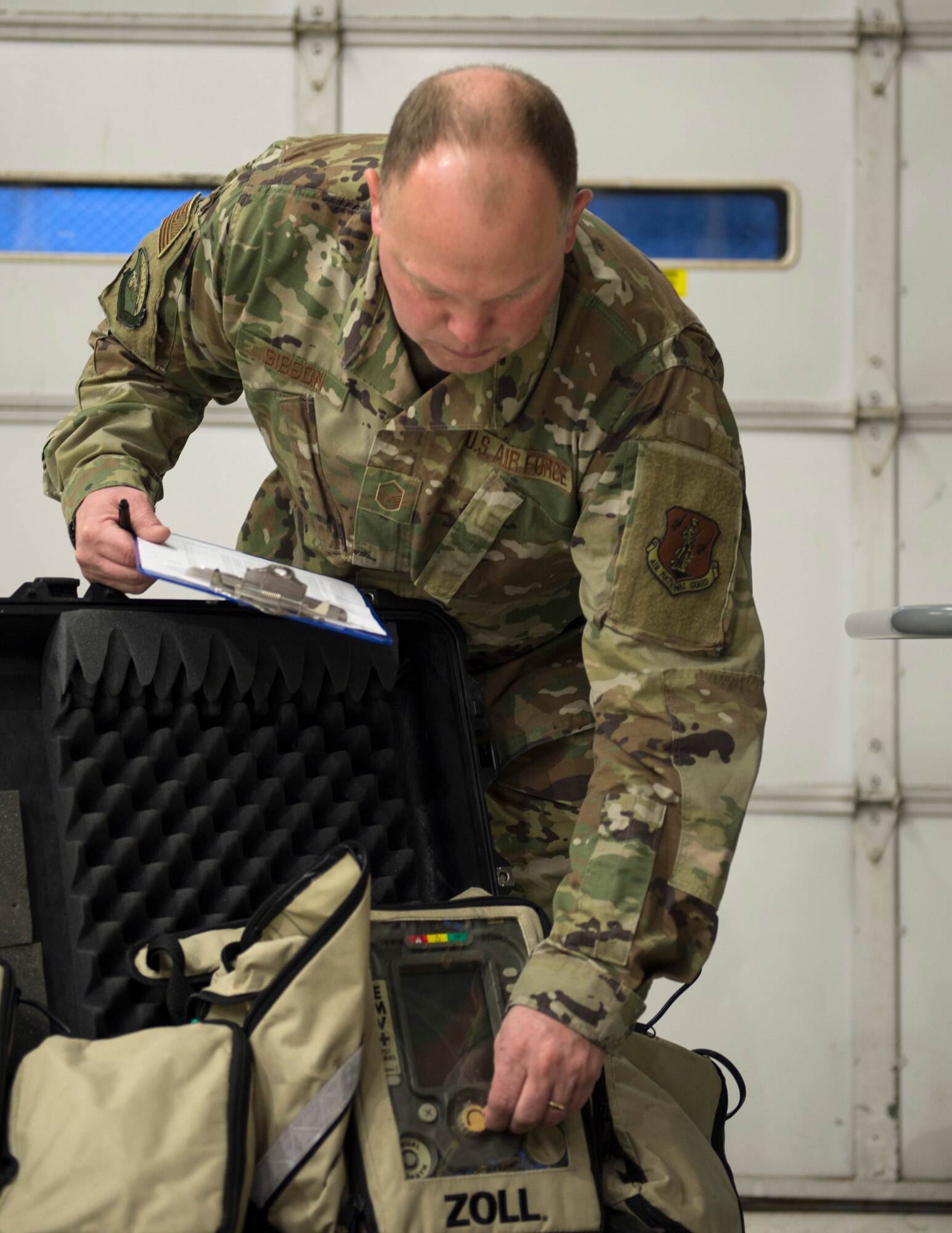 U.S. Air Force Master Sgt. Sean Gibson, 133rd Chemical, Biological, Radiological and Nuclear Defense (CBRN) Enhanced Response Force Package, completes an inventory check of the Zoll 731 Ventilators in St. Paul, Minn., Mar., 19, 2020.