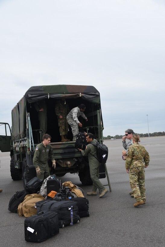 With less than  24 hours’ notice, doctors and nurses assigned to the 927th Air Refueling Wing, boarded a C-130 at MacDill AFB, Fla., April 5, headed for Joint Base McGuire-Lakehurst, N.J. where they will be a part of more than 100 medical professionals sent from Air Force Reserve Command to work with state and local authorities in the region as they combat COVID-19. (U.S. Air Force photo by Tech. Sgt. Peter Dean)