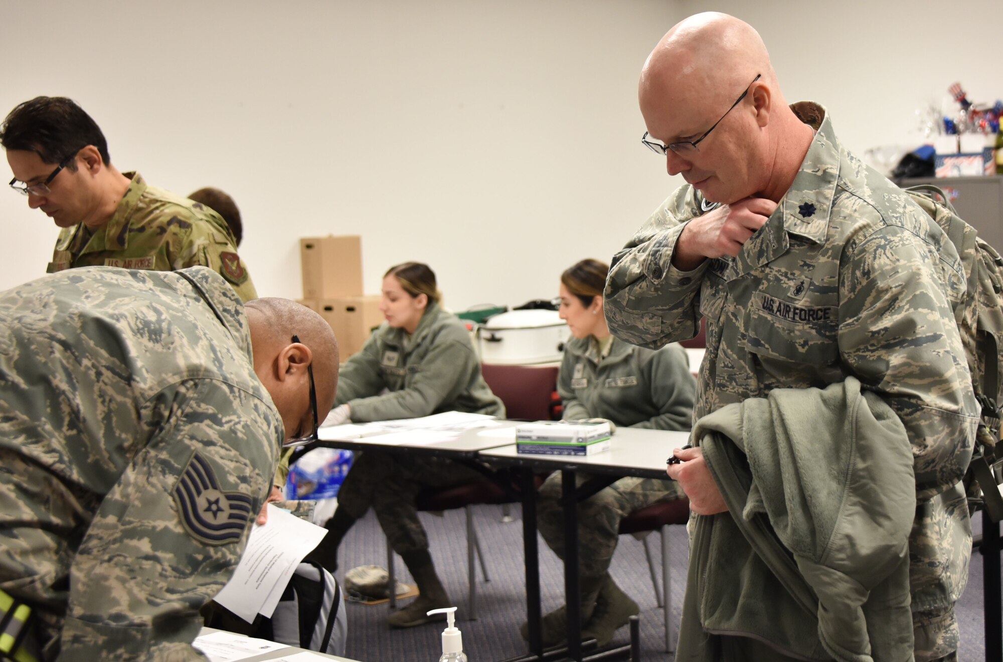 Deploying Airmen from the 301st Fighter Wing Medical Squadron process through a personnel deployment function (PDF) line at U.S. Naval Air Station Joint Reserve Base, Fort Worth, Texas on April 5, 2020. This deployment is part of a larger mobilization package of more than 120 doctors, nurses, and respiratory technicians Air Force Reserve units across the nation provided over the past 48 hours of COVID-19 response to take care of Americans. (U.S. Air Force photos by Capt. Jessica Gross and Tech. Sgt. Melissa Harvey)