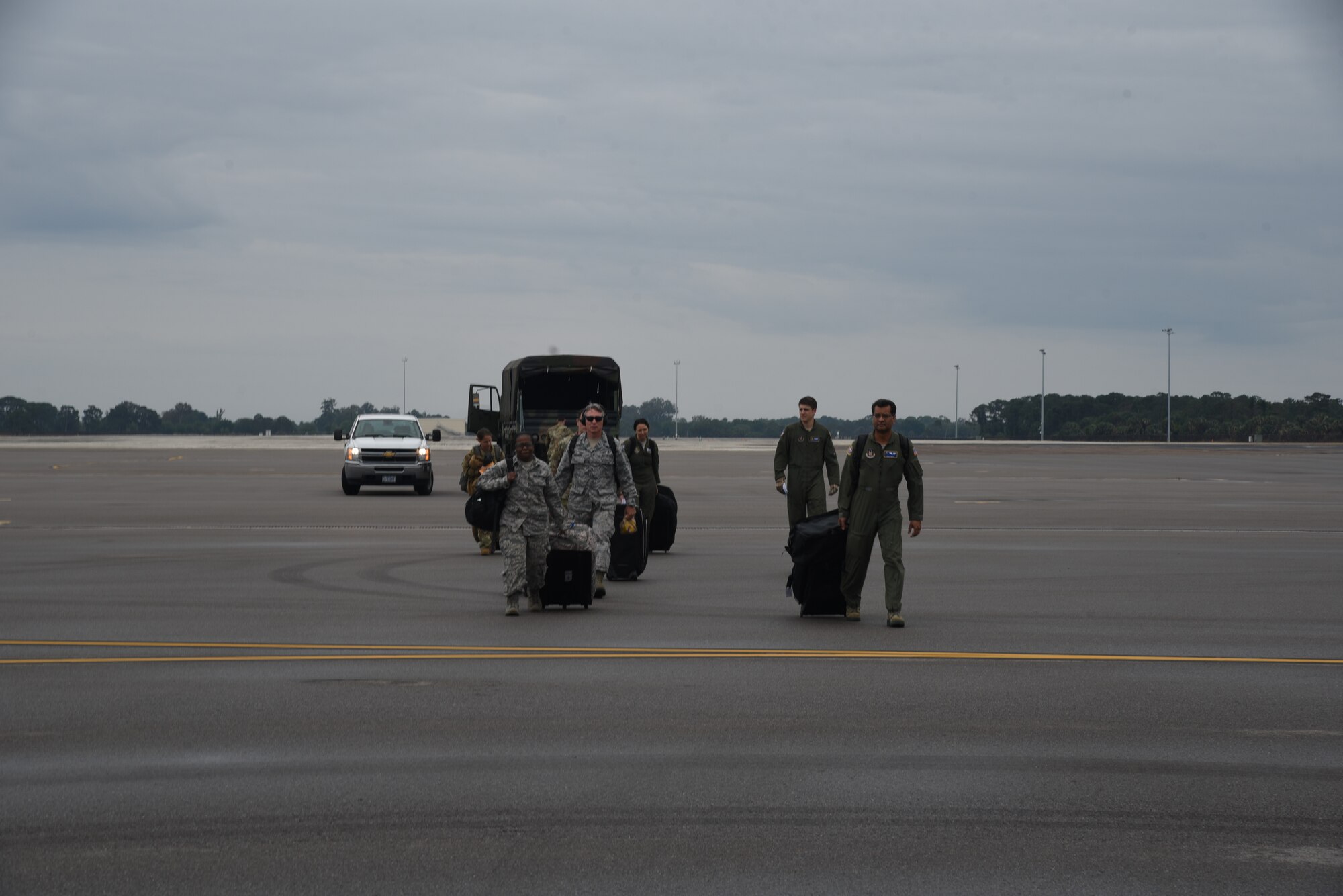 With less than  24 hours’ notice, doctors and nurses assigned to the 927th Air Refueling Wing, boarded a C-130 at MacDill AFB, Fla., April 5, headed for Joint Base McGuire-Lakehurst, N.J. where they will be a part of more than 100 medical professionals sent from Air Force Reserve Command to work with state and local authorities in the region as they combat COVID-19. (U.S. Air Force photo by Tech. Sgt. Peter Dean)